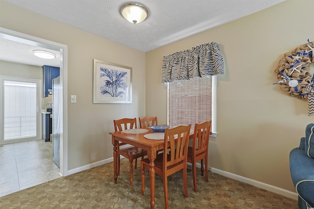 401 77th Ave N Unit 11, Myrtle Beach, SC 29572 - dining area with baseboards and a textured ceiling