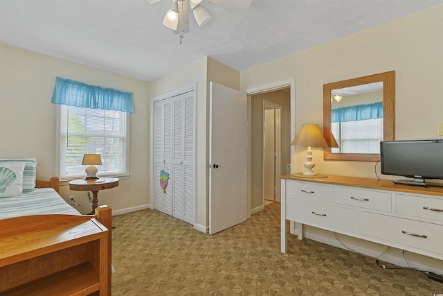 401 77th Ave N Unit 11, Myrtle Beach, SC 29572 - bedroom with multiple windows, a closet, a ceiling fan, and light flooring
