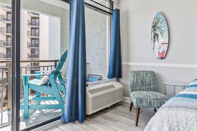 bedroom with baseboards and wood finished floors