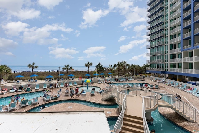 community pool featuring a water view
