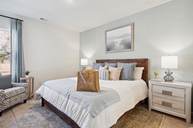 carpeted bedroom with visible vents