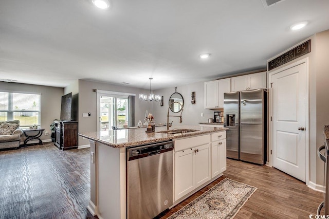777 Woodland Farms Cir, Aynor, SC 29511 - kitchen featuring a sink, white cabinets, appliances with stainless steel finishes, and wood finished floors