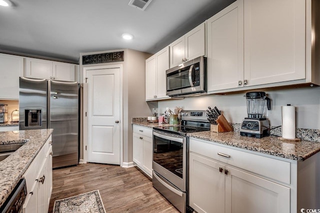 777 Woodland Farms Cir, Aynor, SC 29511 - kitchen featuring white cabinetry, recessed lighting, appliances with stainless steel finishes, and light wood-style floors