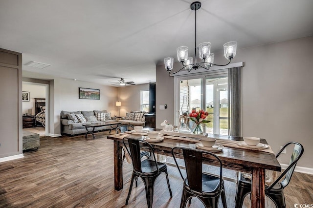 777 Woodland Farms Cir, Aynor, SC 29511 - dining space featuring wood finished floors, visible vents, baseboards, and ceiling fan with notable chandelier