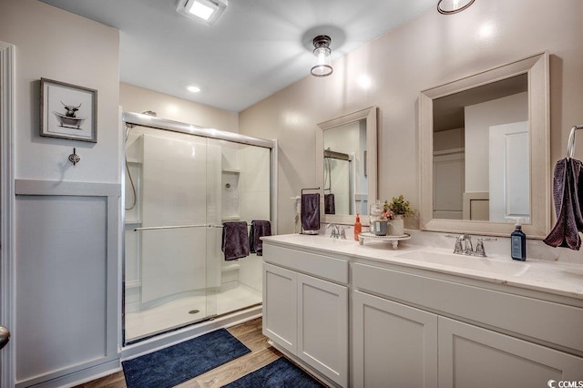 777 Woodland Farms Cir, Aynor, SC 29511 - bathroom featuring a stall shower, double vanity, a sink, and wood finished floors