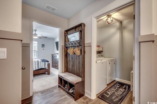 777 Woodland Farms Cir, Aynor, SC 29511 - interior space featuring wood finished floors, separate washer and dryer, laundry area, ceiling fan, and visible vents