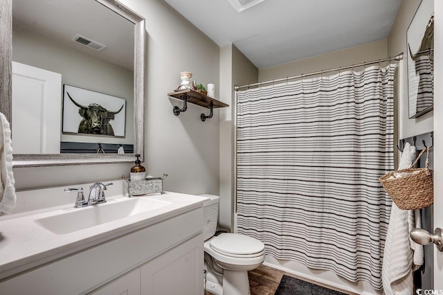 777 Woodland Farms Cir, Aynor, SC 29511 - bathroom with wood finished floors, a shower with curtain, toilet, vanity, and visible vents
