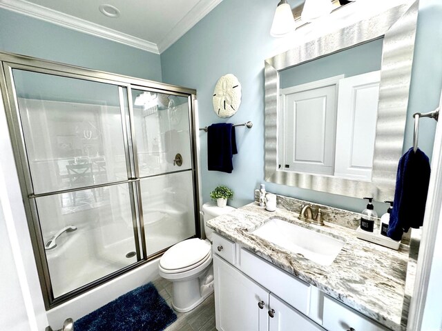 412 29th Ave N, North Myrtle Beach, SC 29582 - full bathroom featuring a shower stall, toilet, vanity, and crown molding