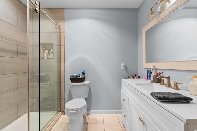 full bath featuring vanity, tile patterned floors, a tile shower, and toilet