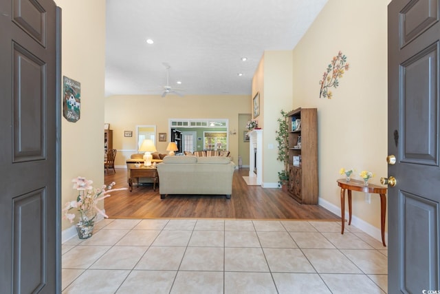 entryway with recessed lighting, ceiling fan, baseboards, and light wood finished floors