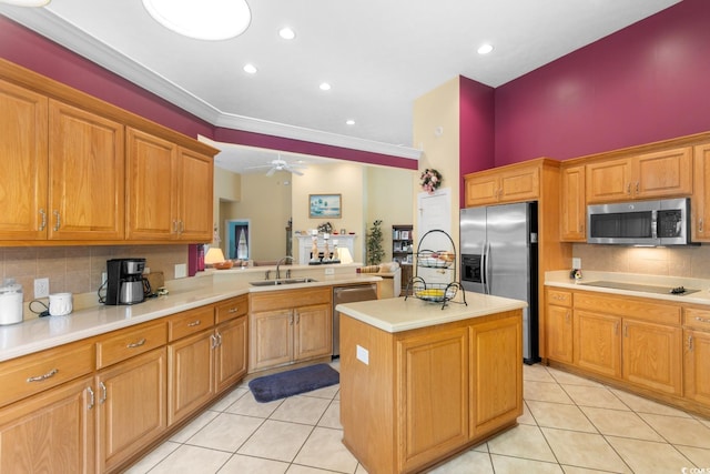 kitchen with a sink, light tile patterned floors, stainless steel appliances, and light countertops