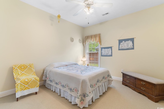 bedroom with light colored carpet, baseboards, ceiling fan, and visible vents