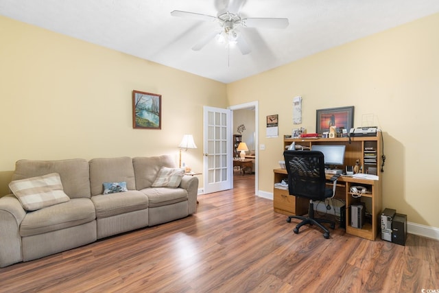 office area with a ceiling fan, baseboards, french doors, and wood finished floors