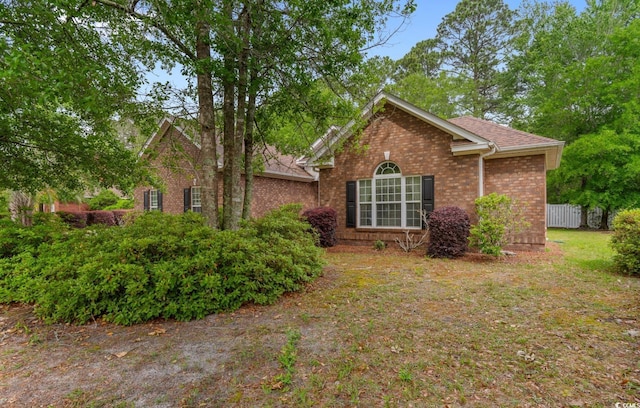 view of front of property featuring brick siding