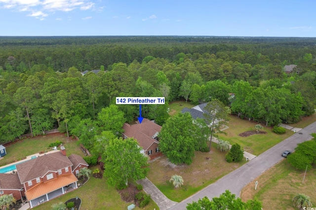 aerial view featuring a forest view