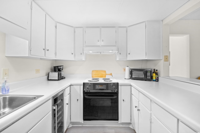 311 71st Ave N Unit 3-D, Myrtle Beach, SC 29572 - kitchen with black microwave, electric stove, white cabinetry, wine cooler, and under cabinet range hood
