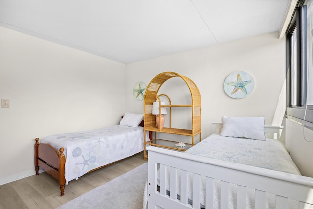 311 71st Ave N Unit 3-D, Myrtle Beach, SC 29572 - bedroom featuring baseboards and wood finished floors