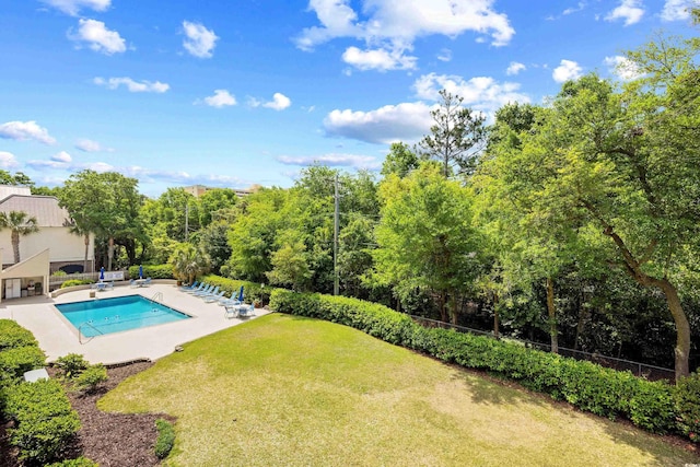 311 71st Ave N Unit 3-D, Myrtle Beach, SC 29572 - pool featuring a lawn, fence, and a patio area
