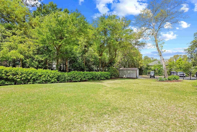 311 71st Ave N Unit 3-D, Myrtle Beach, SC 29572 - view of yard with fence, an outbuilding, and a shed