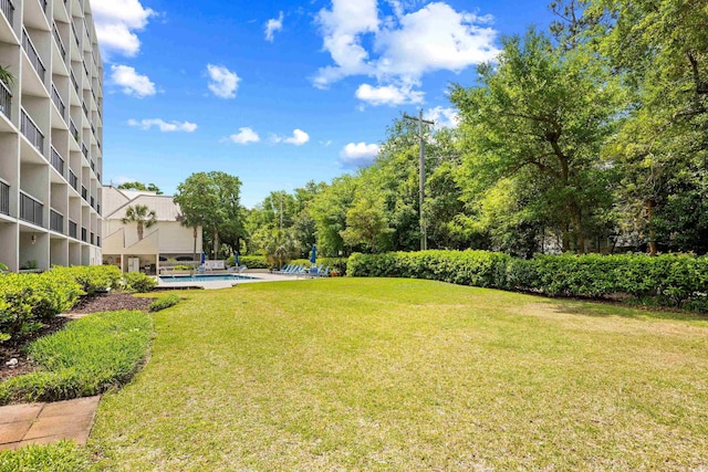 311 71st Ave N Unit 3-D, Myrtle Beach, SC 29572 - view of yard with a fenced in pool