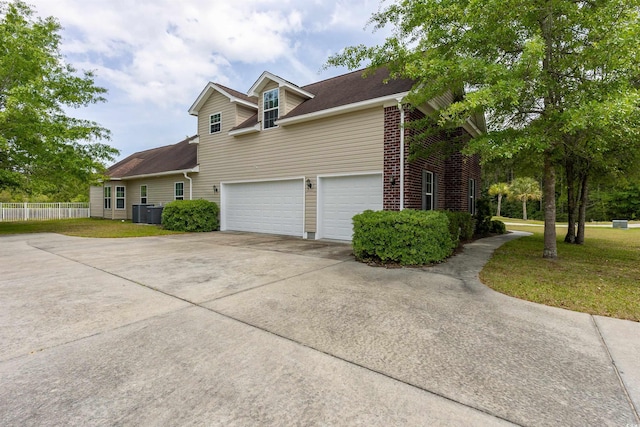 133 Alpharetta Ct, Conway, SC 29526 - view of property exterior featuring concrete driveway, a garage, cooling unit, and brick siding