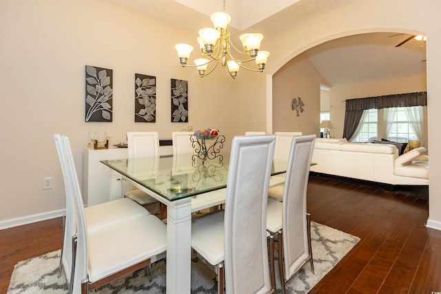 133 Alpharetta Ct, Conway, SC 29526 - dining room with arched walkways, a chandelier, dark wood finished floors, lofted ceiling, and baseboards