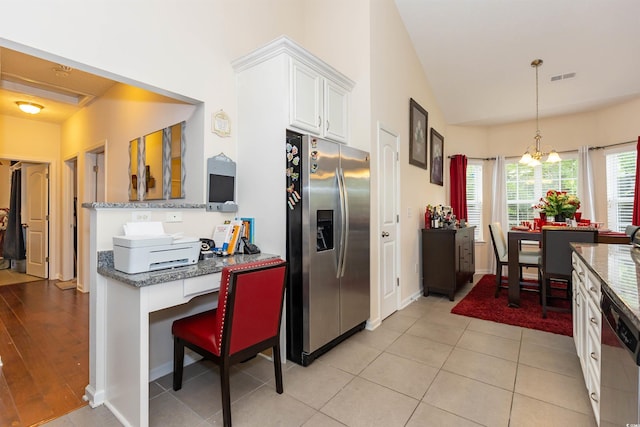 133 Alpharetta Ct, Conway, SC 29526 - kitchen featuring appliances with stainless steel finishes, white cabinetry, stone counters, decorative light fixtures, and baseboards