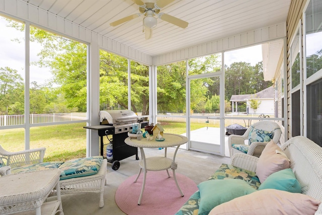 133 Alpharetta Ct, Conway, SC 29526 - sunroom featuring a ceiling fan and view of wooded area