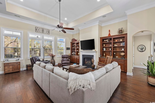 200 Stonefly Ct, Murrells Inlet, SC 29576 - living room with dark wood-type flooring, baseboards, a glass covered fireplace, and a tray ceiling