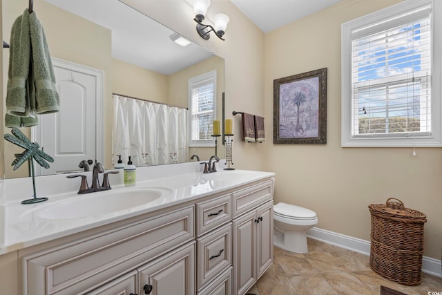 200 Stonefly Ct, Murrells Inlet, SC 29576 - bathroom featuring baseboards, a sink, double vanity, and toilet