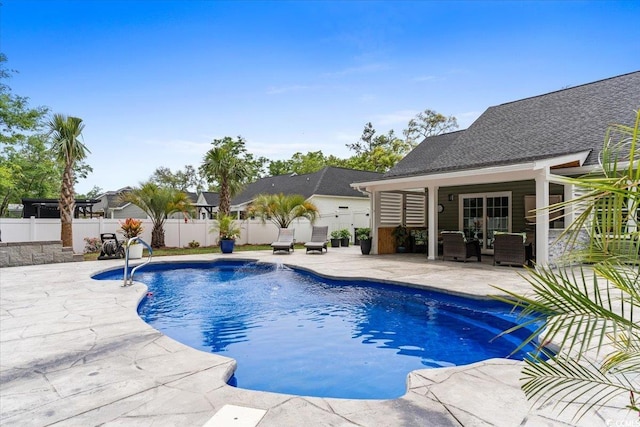 view of swimming pool with a patio, a fenced in pool, and a fenced backyard