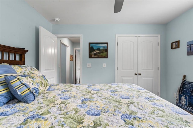 bedroom featuring ceiling fan and a closet