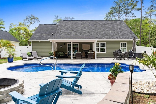 view of swimming pool featuring a patio, a fenced in pool, an outdoor living space with a fire pit, outdoor dining space, and fence private yard