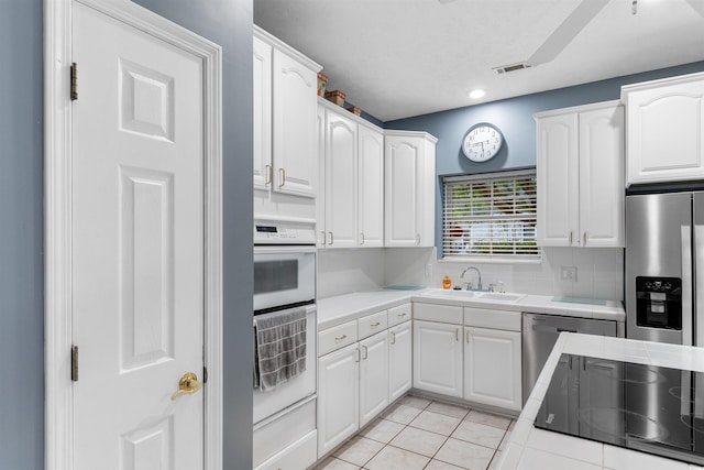 4721 National Dr, Myrtle Beach, SC 29579 - kitchen with white cabinetry, stainless steel appliances, and a sink