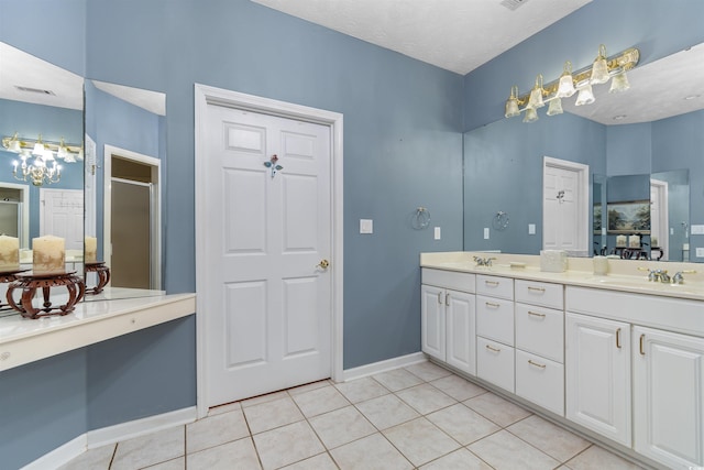 4721 National Dr, Myrtle Beach, SC 29579 - full bathroom with baseboards, a sink, tile patterned flooring, double vanity, and an enclosed shower