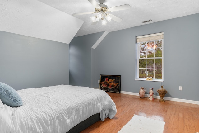 4721 National Dr, Myrtle Beach, SC 29579 - bedroom with ceiling fan, a textured ceiling, baseboards, and wood finished floors
