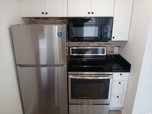 kitchen featuring white cabinets, tasteful backsplash, and stainless steel appliances