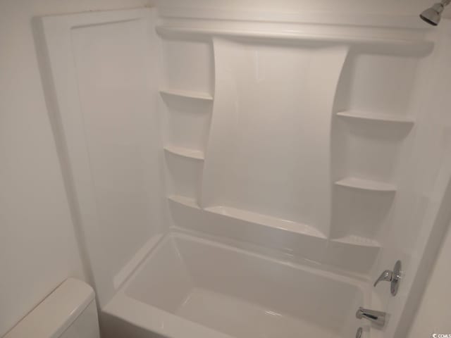 full bathroom featuring bathtub / shower combination and toilet