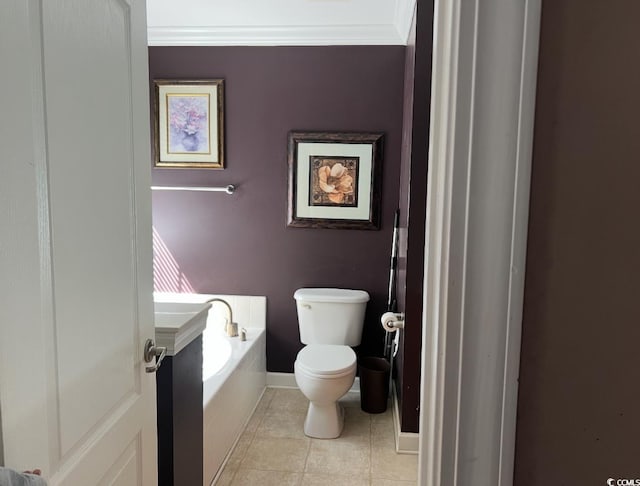 1440 Brighton Ave, Myrtle Beach, SC 29588 - bathroom featuring toilet, a bath, tile patterned flooring, crown molding, and baseboards
