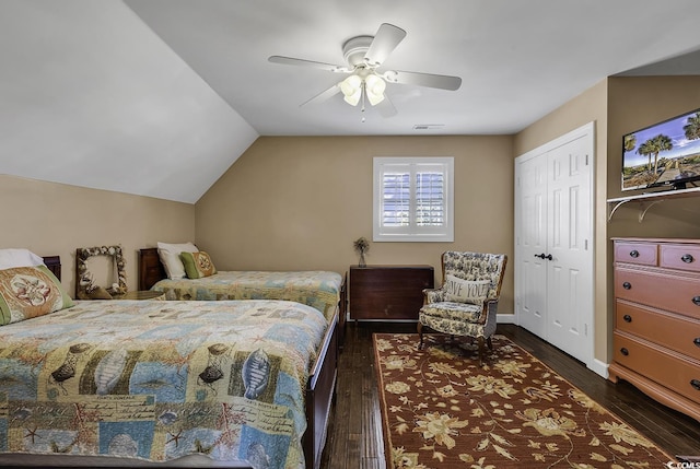 bedroom with vaulted ceiling, ceiling fan, dark wood-style floors, and visible vents