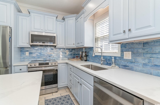 6001-1872 S Kings Hwy, Myrtle Beach, SC 29575 - kitchen with crown molding, decorative backsplash, light tile patterned flooring, a sink, and stainless steel appliances