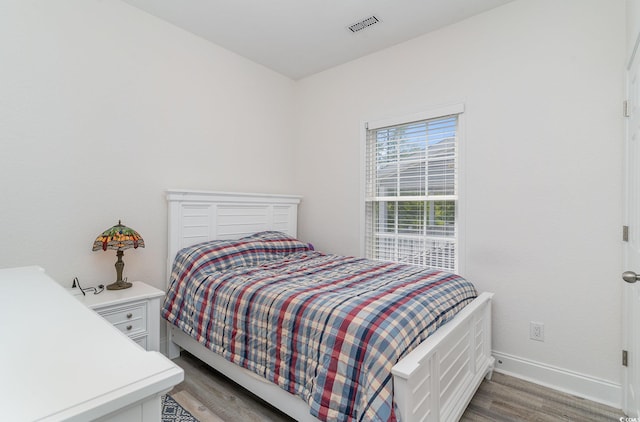 6001-1872 S Kings Hwy, Myrtle Beach, SC 29575 - bedroom featuring baseboards, visible vents, and light wood-type flooring