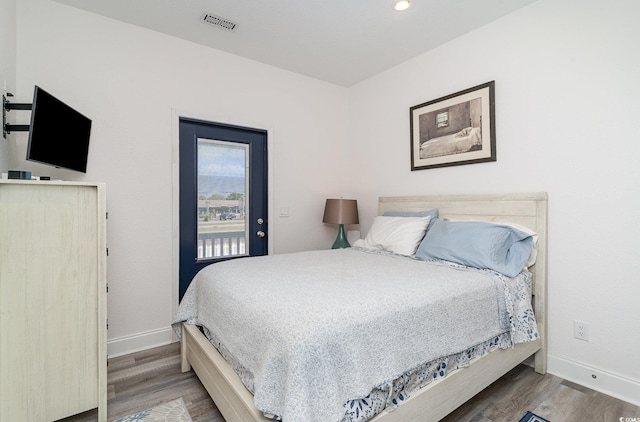 6001-1872 S Kings Hwy, Myrtle Beach, SC 29575 - bedroom featuring baseboards, access to outside, and wood finished floors