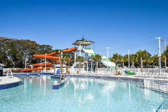6001-1872 S Kings Hwy, Myrtle Beach, SC 29575 - community pool with fence and a water slide