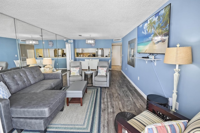 9820 Queensway Blvd Unit 704, Myrtle Beach, SC 29572 - living area featuring dark wood-style flooring, a textured ceiling, and a chandelier