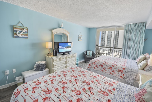 9820 Queensway Blvd Unit 704, Myrtle Beach, SC 29572 - bedroom with wood finished floors and a textured ceiling