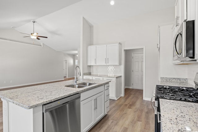 3331 Little Bay Dr, Conway, SC 29526 - kitchen featuring stainless steel appliances, ceiling fan, vaulted ceiling, tasteful backsplash, and white cabinetry