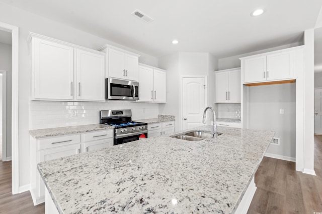 3324 Little Bay Dr, Conway, SC 29526 - kitchen featuring appliances with stainless steel finishes, a sink, a kitchen island with sink, white cabinetry, and recessed lighting