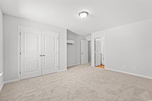 3324 Little Bay Dr, Conway, SC 29526 - unfurnished bedroom featuring a wall mounted air conditioner, carpet floors, baseboards, and a closet