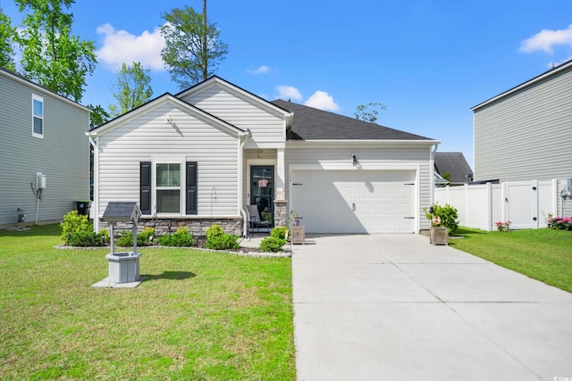 155 Marsh Deer Pl, Surfside Beach, SC 29575 - view of front of property featuring a front yard, driveway, an attached garage, and fence